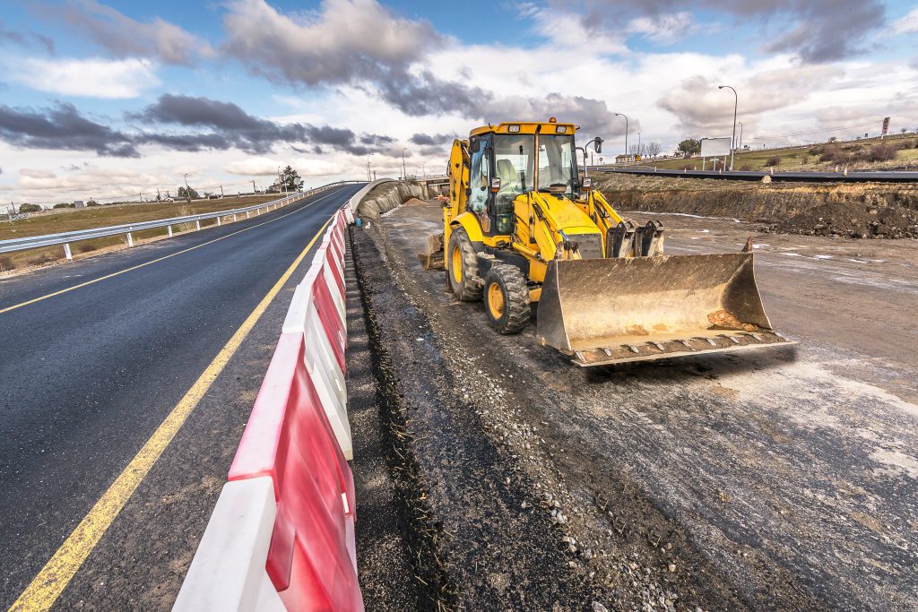 Excavator on the construction works of a highway